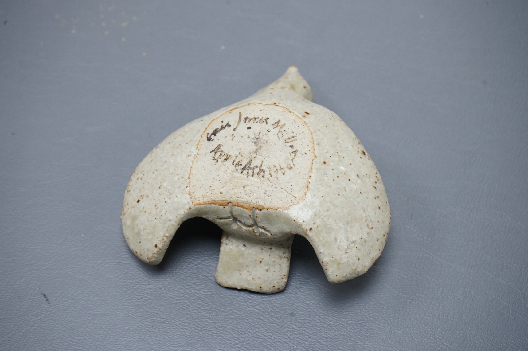 Eric James Mellon (1925 - 2014), a small studio pottery and apple ash-glazed model of a bird, 10cm wide